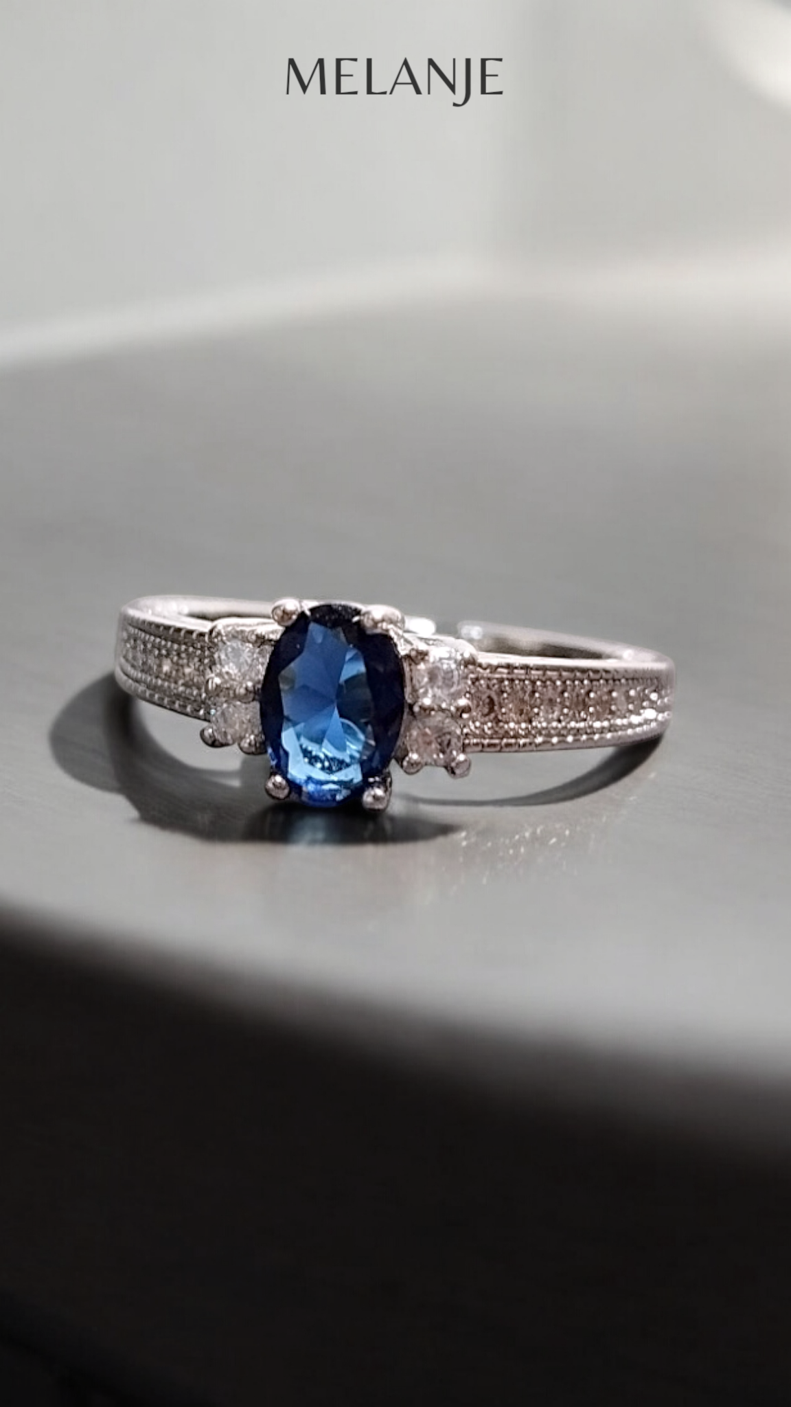 Sterling Silver Sapphire Blue Oval Solitaire Crystal Single-Row Design Adjustable Ring